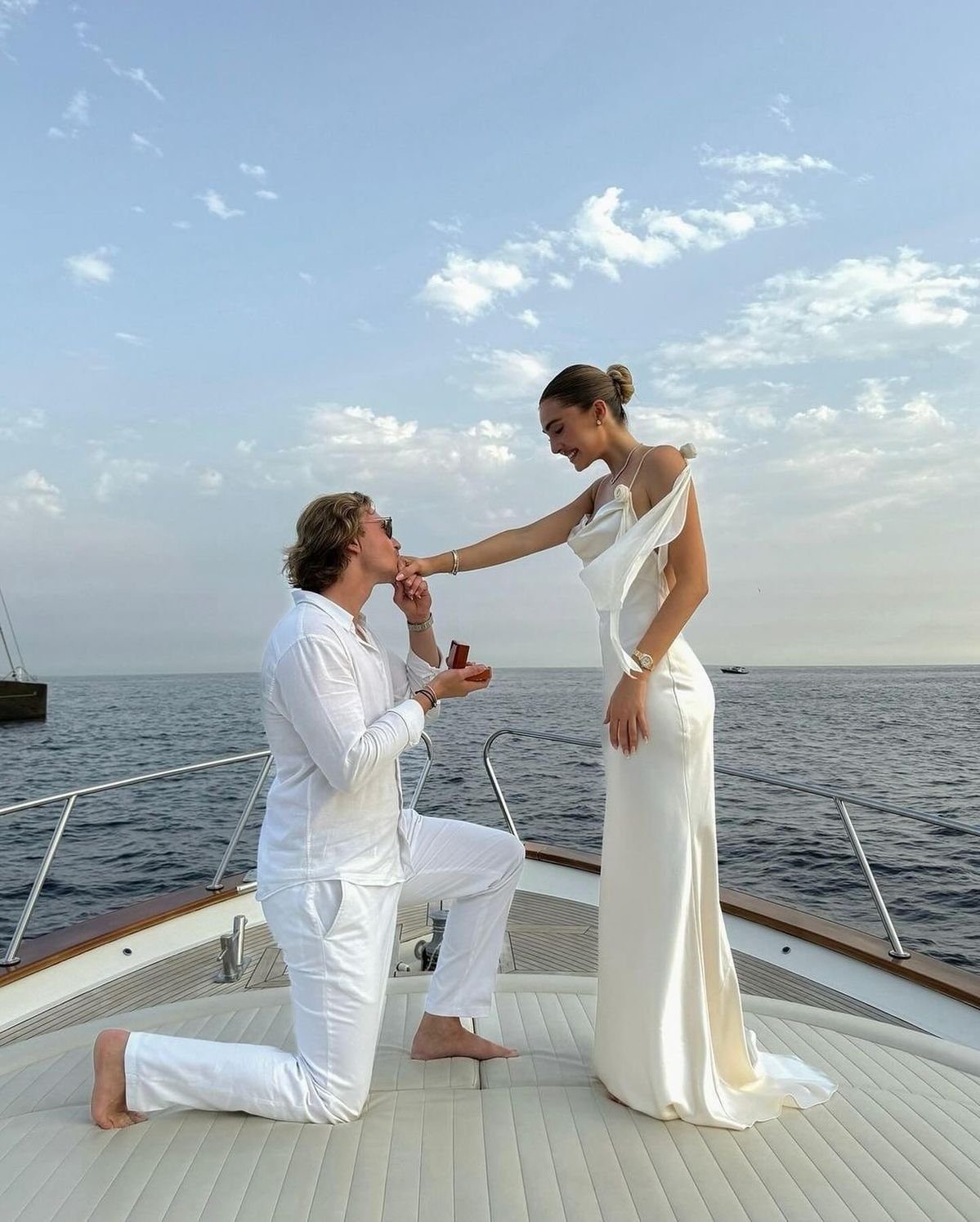 Marriage proposal on the bow of a yacht